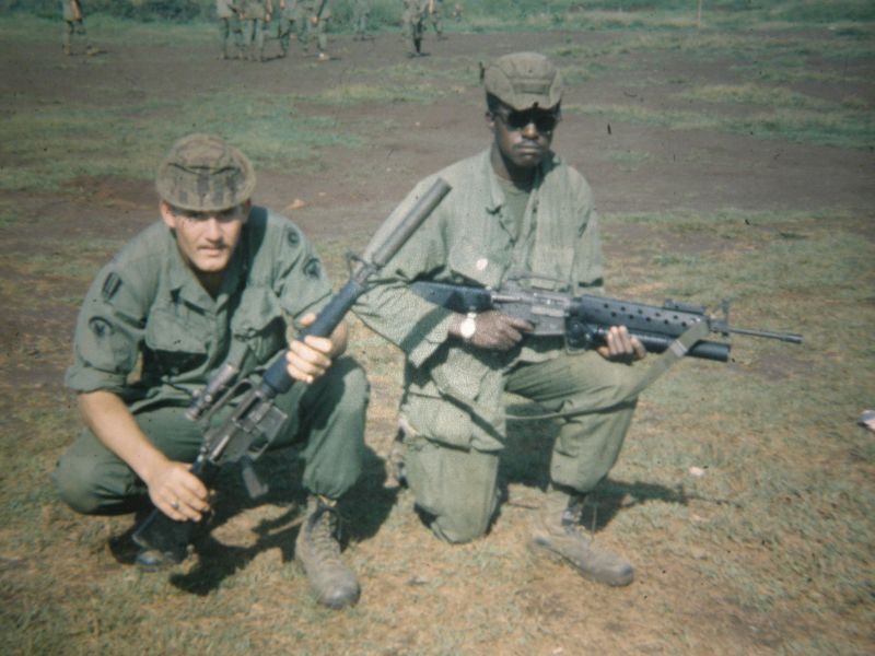 M16A1 with HEL suppressor M203 in background