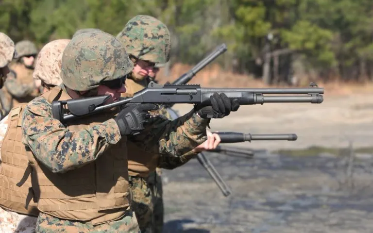Marines firing shotguns.